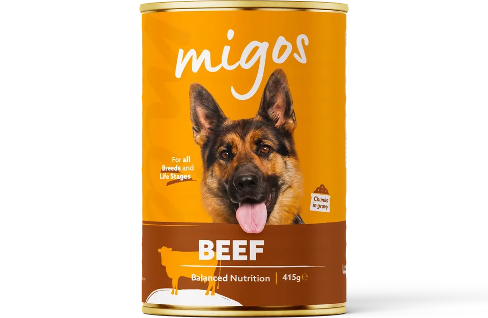 Can of Migos beef wet dog food, 415g, with chunks in gravy, for all breeds and life stages.
