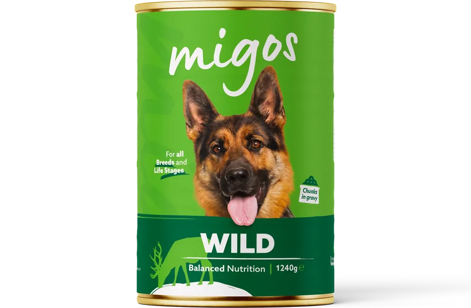 Can of Migos wild wet dog food, 1240g, with chunks in gravy, for all breeds and life stages.
